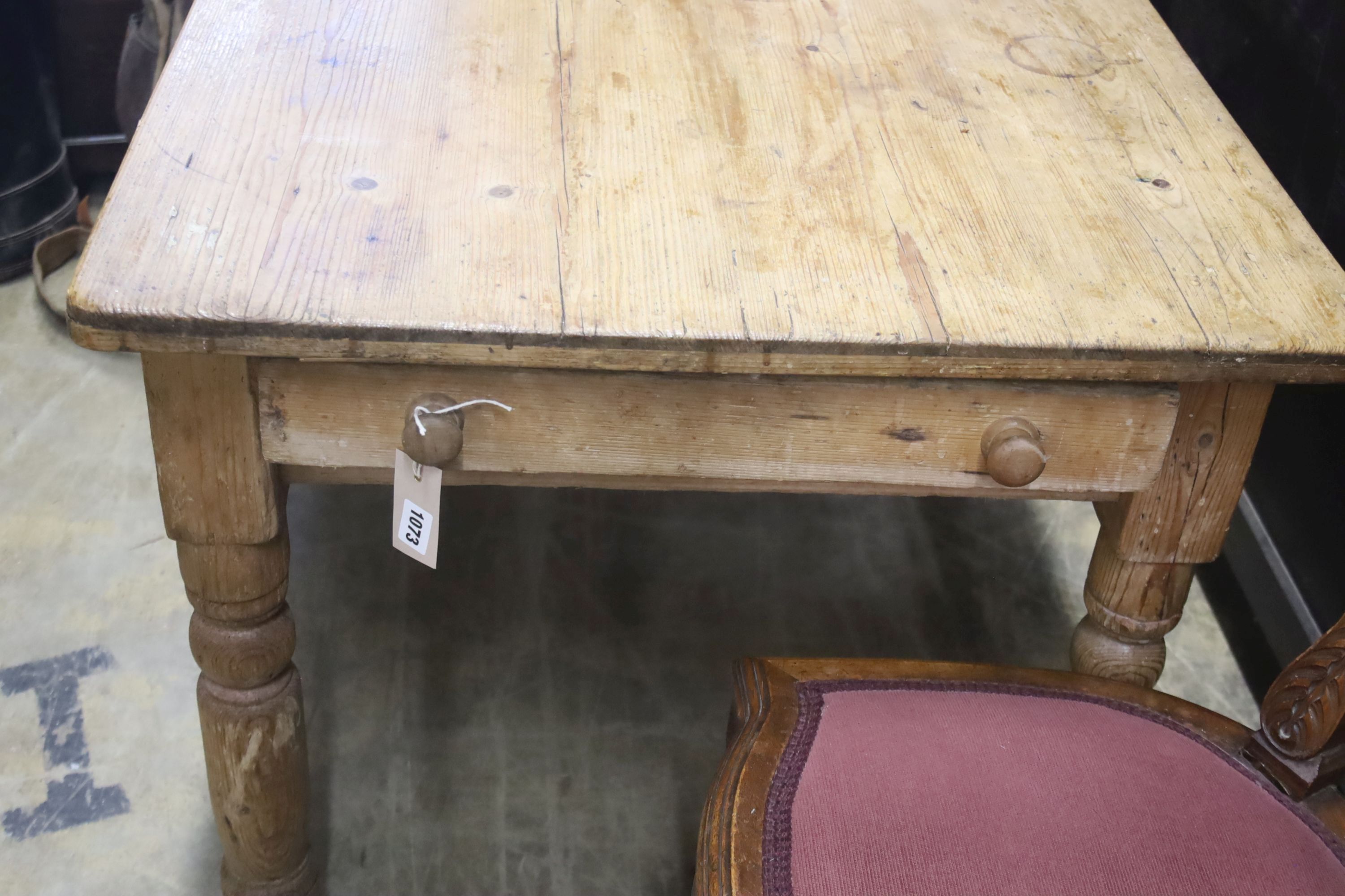A rectangular pine kitchen table, length 112cm, depth 75cm, height 72cm